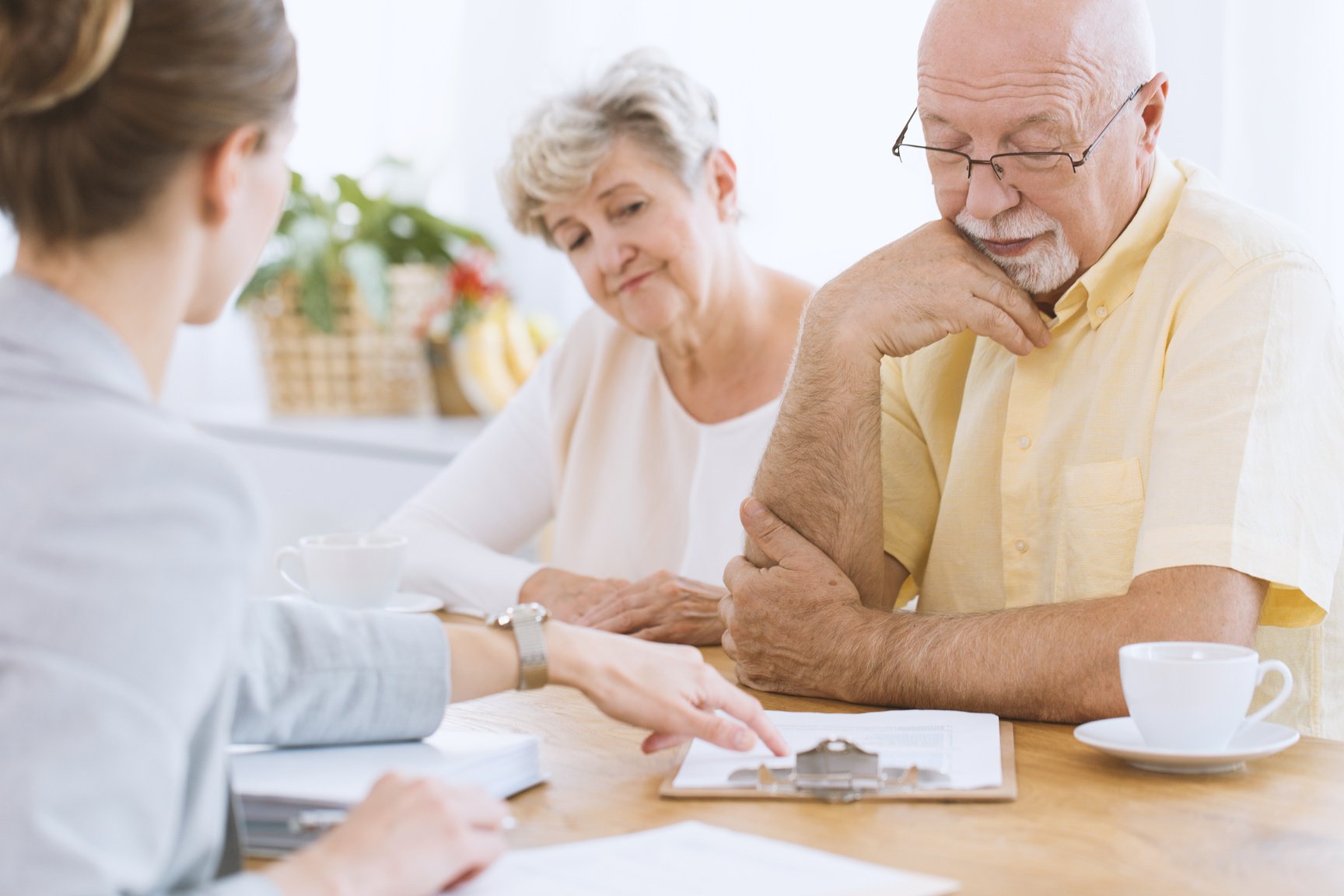 Senior people signing life insurance